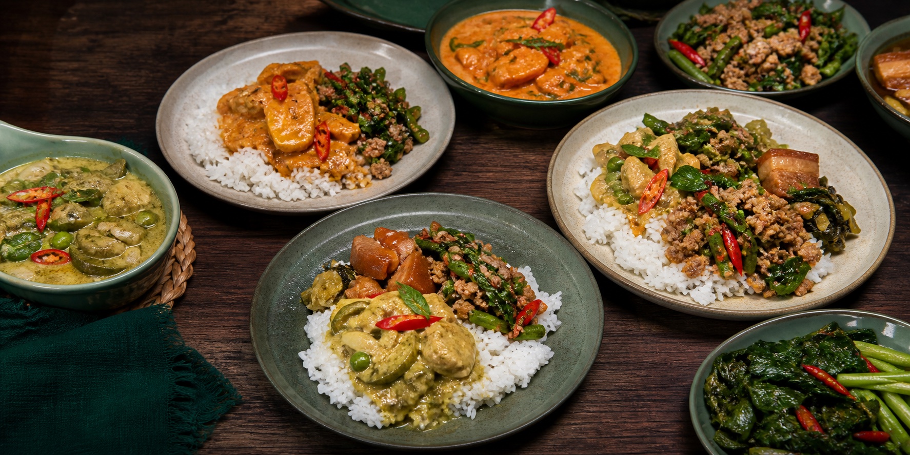 An abundant spread of Khao Gang curries, stir-fries and jasmine rice